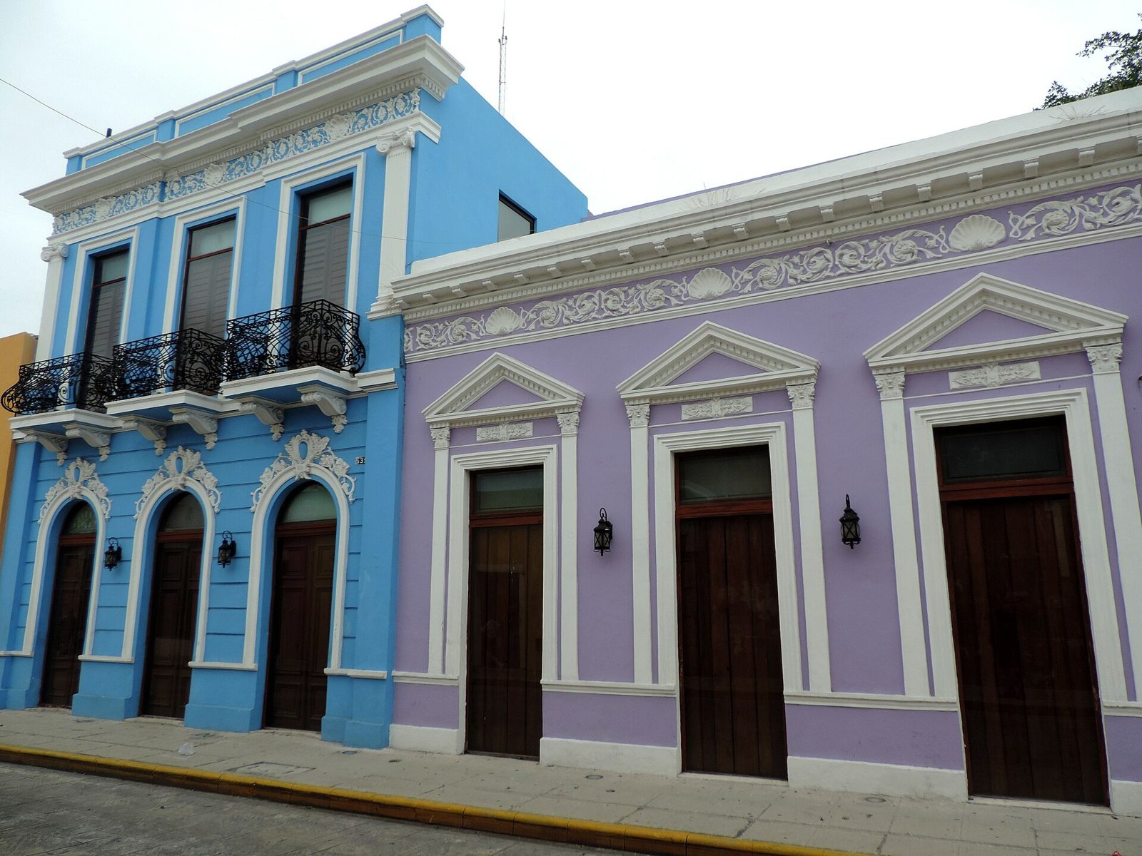Renovated colonial houses painted blue and lilac in central Mérida